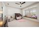 Bedroom with a comfortable armchair, crib, ceiling fan, and a window seat at 1100 Virginia Ne Ave, Atlanta, GA 30306
