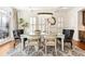 Elegant dining room with a modern chandelier, large windows with shutters, and stylish decor at 1100 Virginia Ne Ave, Atlanta, GA 30306