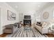 Comfortable living room with a fireplace, neutral decor, and a stylish rug at 1100 Virginia Ne Ave, Atlanta, GA 30306