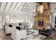 Bright living room with a stone fireplace, white vaulted ceiling, and neutral furnishings at 1100 Virginia Ne Ave, Atlanta, GA 30306
