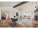 Open-concept living room with stone fireplace, vaulted ceiling, and views into dining area at 1100 Virginia Ne Ave, Atlanta, GA 30306