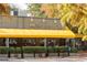 Murphy's restaurant in the neighborhood with yellow awning and lush foliage at 1100 Virginia Ne Ave, Atlanta, GA 30306