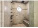 Bright, tiled shower featuring multiple shower heads, a window, and a built-in bench at 1100 Virginia Ne Ave, Atlanta, GA 30306