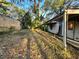 Rustic backyard with some greenery, a modest overhang, and a shed-like structure at 1199 Warfield Nw St, Atlanta, GA 30318