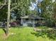 A charming home with a fenced yard and blooming flowers at 1199 Warfield Nw St, Atlanta, GA 30318