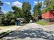 Residential street view with sidewalks, curbs, and some houses at 1199 Warfield Nw St, Atlanta, GA 30318
