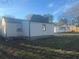 View of the backyard showing the home's exterior and fencing at 2077 Brockett Rd, Tucker, GA 30084