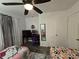 Cozy bedroom featuring neutral walls, bright light and hardwood floors at 2077 Brockett Rd, Tucker, GA 30084