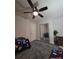 Cozy bedroom featuring a ceiling fan and mirrored closet doors at 2077 Brockett Rd, Tucker, GA 30084