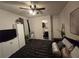 Bedroom featuring ensuite bathroom, comfortable bed and pillows, and modern decor, creating a cozy personal space at 2077 Brockett Rd, Tucker, GA 30084