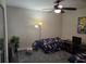 A bright room featuring a ceiling fan and a themed decor at 2077 Brockett Rd, Tucker, GA 30084