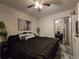 Comfortable bedroom with a large bed, mirrored closet, and contemporary artwork create a relaxing retreat at 2077 Brockett Rd, Tucker, GA 30084