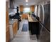 Updated kitchen with modern appliances, countertops, and cabinetry, perfect for cooking and entertaining at 2077 Brockett Rd, Tucker, GA 30084