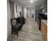 Open-concept kitchen featuring stainless steel appliances, granite countertops, and light wood cabinets at 2077 Brockett Rd, Tucker, GA 30084