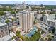 High-rise apartment building with a pool and tennis court in an urban setting at 325 E Paces Ferry Ne Rd # 907, Atlanta, GA 30305