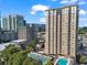 Luxury high-rise boasts a pool and tennis court with city views in the background at 325 E Paces Ferry Ne Rd # 907, Atlanta, GA 30305