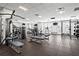 Community gym with modern equipment, free weights, multiple machines, benches and several wall-mounted TVs at 325 E Paces Ferry Ne Rd # 907, Atlanta, GA 30305