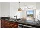 Kitchen view showcasing stainless steel appliances, granite counters, and an open layout to the living area at 325 E Paces Ferry Ne Rd # 907, Atlanta, GA 30305