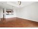 Bright, open-concept living area with hardwood floors connected to the kitchen at 325 E Paces Ferry Ne Rd # 907, Atlanta, GA 30305