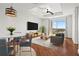 Bright living room featuring a dining area, hardwood floors, and balcony access with great natural light at 325 E Paces Ferry Ne Rd # 907, Atlanta, GA 30305