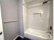 Modern tub and shower combination featuring a rainfall shower head at 1502 Huntingdon Chase, Atlanta, GA 30350