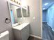 Bathroom with vanity and storage with view to hall with closet space at 1502 Huntingdon Chase, Atlanta, GA 30350