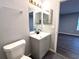 Bathroom featuring a sleek vanity, modern fixtures, and stylish tile flooring at 1502 Huntingdon Chase, Atlanta, GA 30350