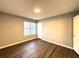 Bright bedroom with hardwood floors and a large window at 1502 Huntingdon Chase, Atlanta, GA 30350