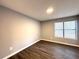 Bedroom with hardwood floors, neutral paint, and ample natural light at 1502 Huntingdon Chase, Atlanta, GA 30350
