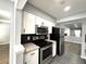 Modern kitchen featuring stainless steel appliances, white cabinets and granite countertops at 1502 Huntingdon Chase, Atlanta, GA 30350