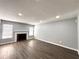 Open living room featuring wood flooring, a fireplace and lots of light at 1502 Huntingdon Chase, Atlanta, GA 30350