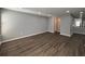 Spacious living room with wood flooring, neutral paint, and bright lighting at 1502 Huntingdon Chase, Atlanta, GA 30350