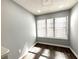 Brightly lit space with wood flooring, neutral paint, and large windows at 1502 Huntingdon Chase, Atlanta, GA 30350