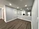 Additional room featuring wood flooring and decorative mirrors at 1502 Huntingdon Chase, Atlanta, GA 30350