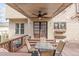 Cozy back porch with outdoor seating, ceiling fan, and classic exterior at 3175 Pond Ridge Trl, Snellville, GA 30078