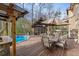 Inviting backyard with a pool, deck, outdoor kitchen, and ample seating for entertaining at 3175 Pond Ridge Trl, Snellville, GA 30078