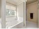 Inviting bathroom with a large soaking tub, shower and bright window at 3175 Pond Ridge Trl, Snellville, GA 30078