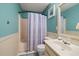 Well-lit bathroom features a tub and shower combo with wainscoting on the lower half of the wall at 3175 Pond Ridge Trl, Snellville, GA 30078