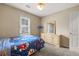 Bedroom with carpet, a window, and a closet, offering a comfortable and functional space at 3175 Pond Ridge Trl, Snellville, GA 30078