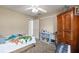 Bedroom featuring carpeted floors, a ceiling fan, and a closet, offering a comfortable living space at 3175 Pond Ridge Trl, Snellville, GA 30078