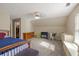 Bedroom featuring carpeted floors, built-in storage, and plenty of space at 3175 Pond Ridge Trl, Snellville, GA 30078