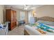Cozy bedroom with carpet, ceiling fan, closet, and a window allowing natural light at 3175 Pond Ridge Trl, Snellville, GA 30078