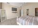 Well-lit bedroom featuring neutral colors, a comfortable bed and ample closet space at 3175 Pond Ridge Trl, Snellville, GA 30078