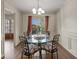 Charming dining room with natural light, stylish furnishings and hardwood floors at 3175 Pond Ridge Trl, Snellville, GA 30078