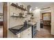 Galley kitchen featuring stainless steel appliances, custom tile backsplash, and modern lighting at 3175 Pond Ridge Trl, Snellville, GA 30078