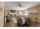 Inviting living room with a stone fireplace, built-in shelving, and hardwood floors at 3175 Pond Ridge Trl, Snellville, GA 30078