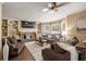 Comfortable living room featuring a stone fireplace, built-in shelves, and lots of natural light at 3175 Pond Ridge Trl, Snellville, GA 30078