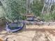 Aerial backyard view featuring playhouse and trampoline in a wooded area at 4853 Chapelle Ct, Marietta, GA 30066