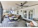 A well-appointed covered patio with ceiling fans and comfortable seating arrangement at 4853 Chapelle Ct, Marietta, GA 30066