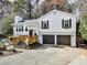 Charming two-story home with white siding, black shutters, and a two-car garage at 4853 Chapelle Ct, Marietta, GA 30066